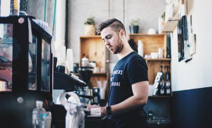 Young man working in cafe